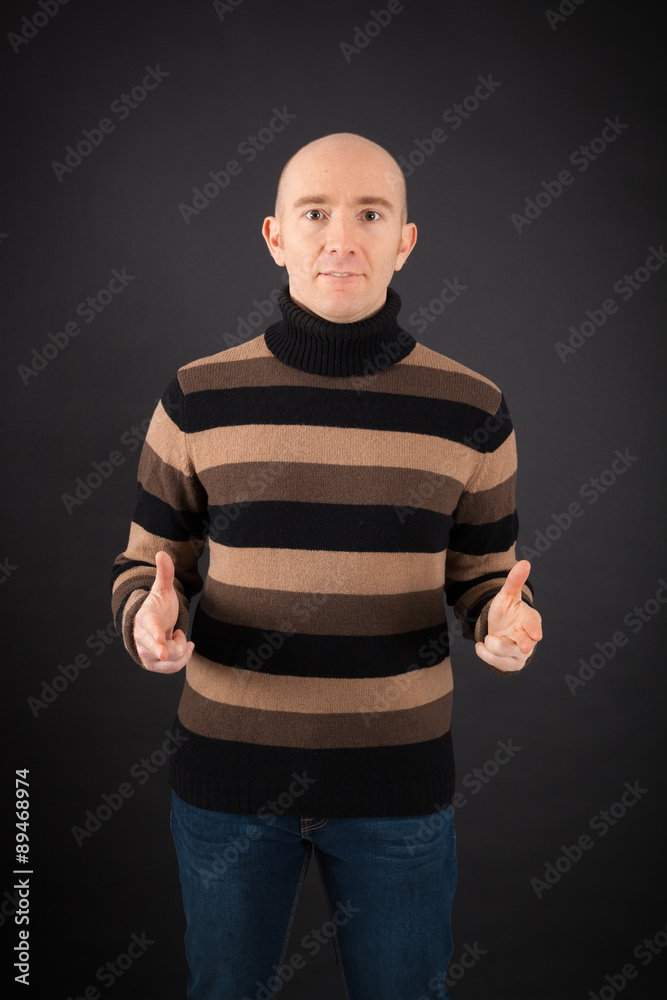 Handsome man doing different expressions in different sets of clothes: gun sign Handsome man doing different expressions in different sets of clothes: gun sign