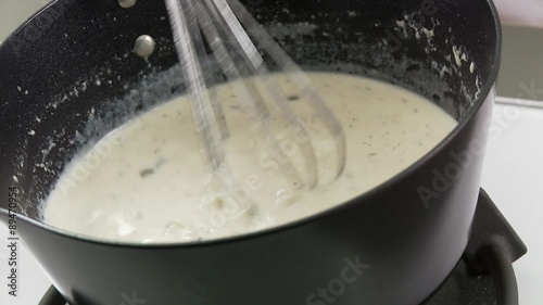 Gorgonzola being added to a cream-stock mixture