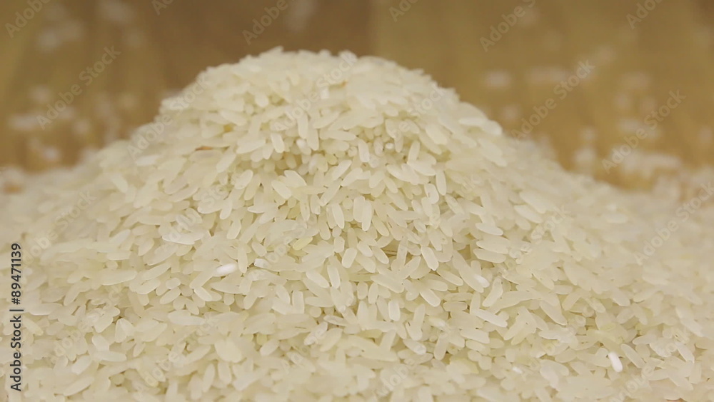 Approximation the pile of rice on a wooden background Approximation the pile of rice on a wooden background