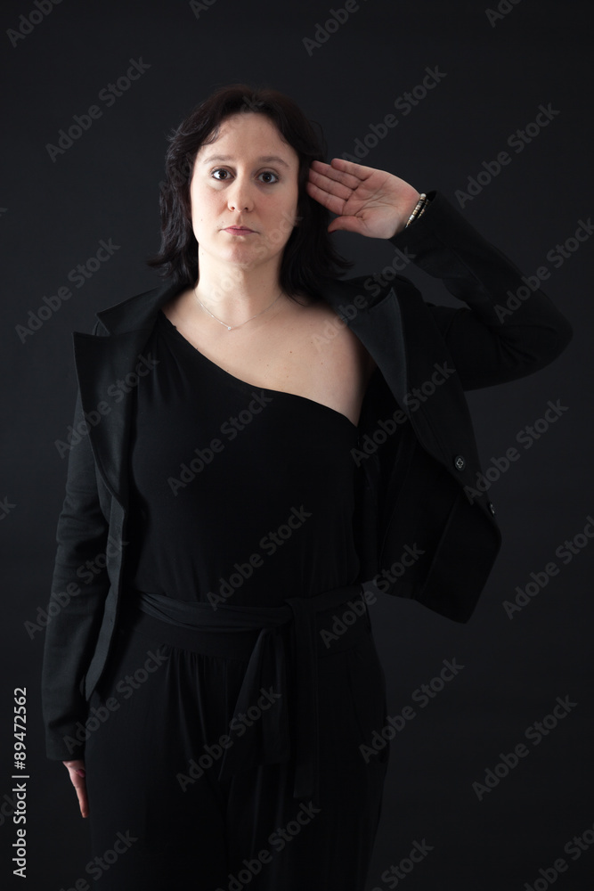 Beautiful woman doing different expressions in different sets of clothes: at attention Beautiful woman doing different expressions in different sets of clothes: at attention