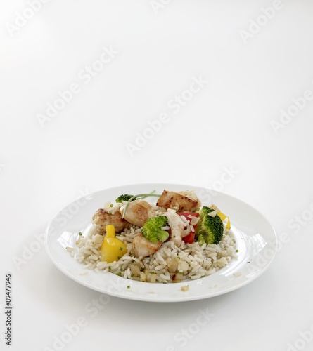 Fried chicken breast with vegetables on rice
