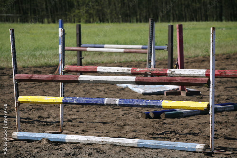 Equitation obstacles and barriers on a training track Equitation obstacles and barriers on a training track