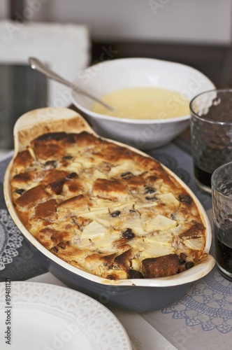 Bread and butter pudding with blueberries and custard