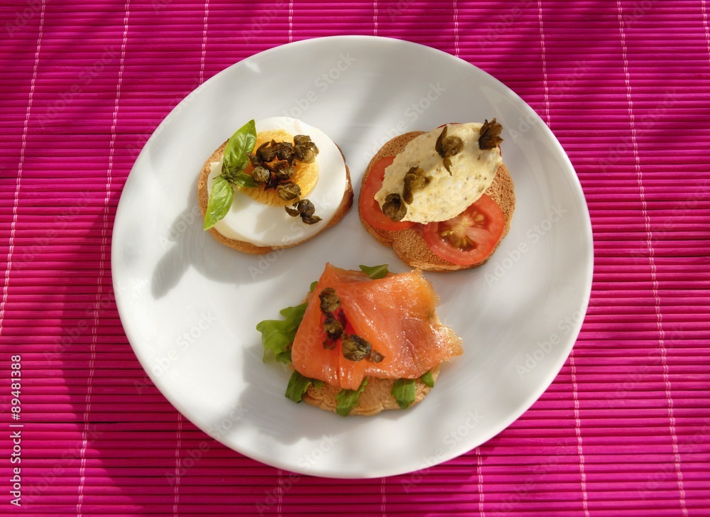 Canapes with salmon mousse, smoked salmon and egg Canapes with salmon mousse, smoked salmon and egg