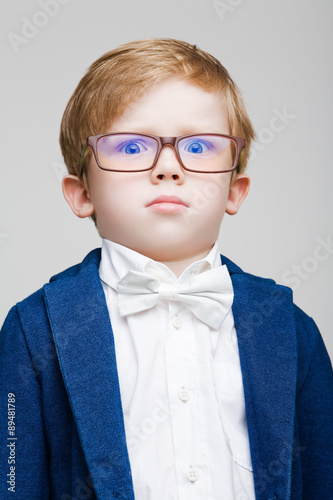 The red-haired kid with glasses puzzled