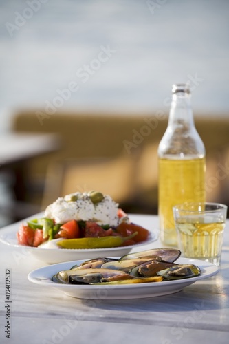 Mussels, Greek salad and white retsina photo