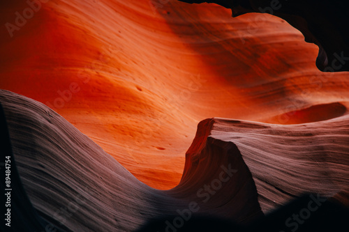 Sunlight waves over sandstone in a slot canyon