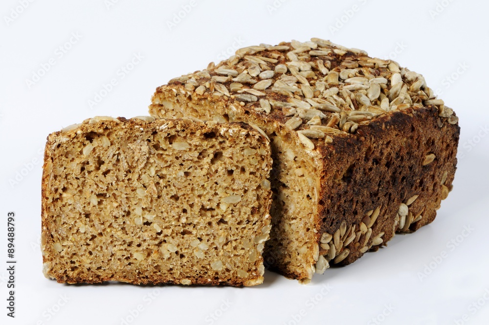Whole-grain bread with sunflower seeds, partly sliced Whole-grain bread with sunflower seeds, partly sliced