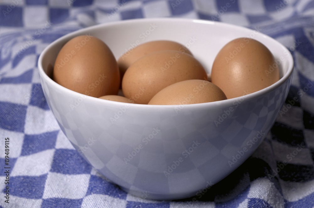 A bowl of brown eggs