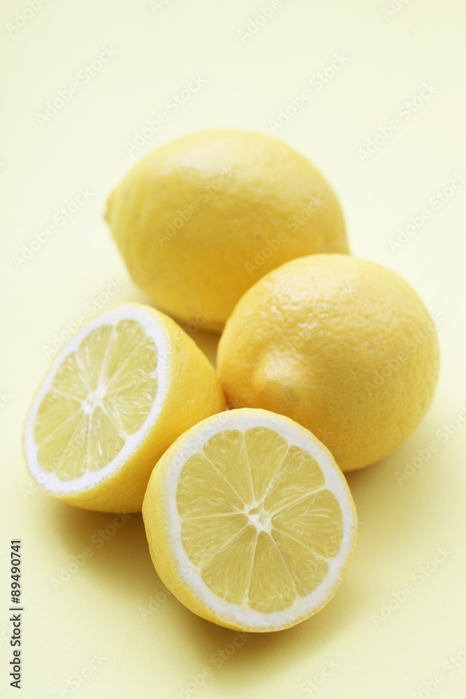 Lemons, two whole and one half Lemons, two whole and one half
