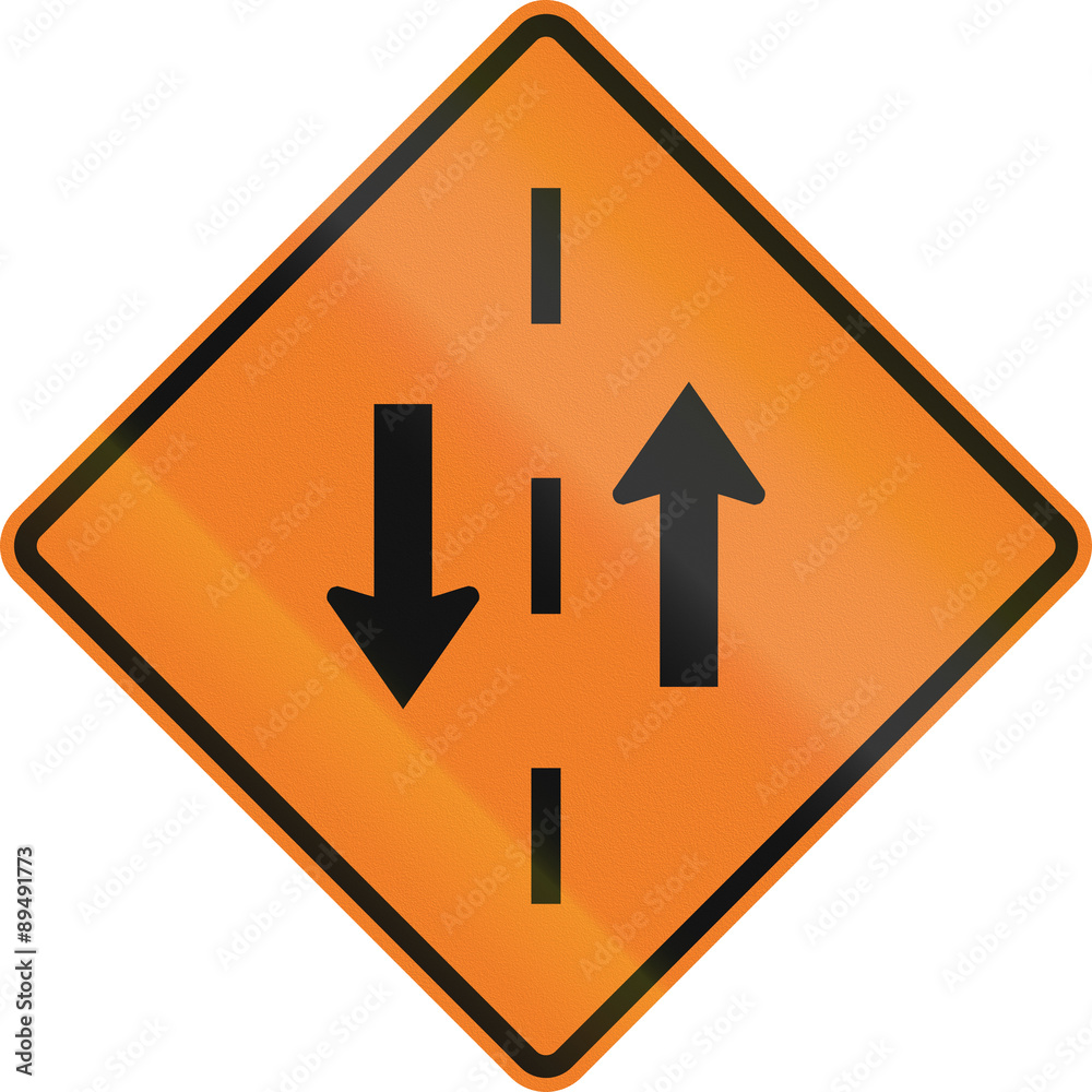 Temporary warning road sign in Canada - Opposing traffic. This sign is used in Ontario Temporary warning road sign in Canada - Opposing traffic. This sign is used in Ontario