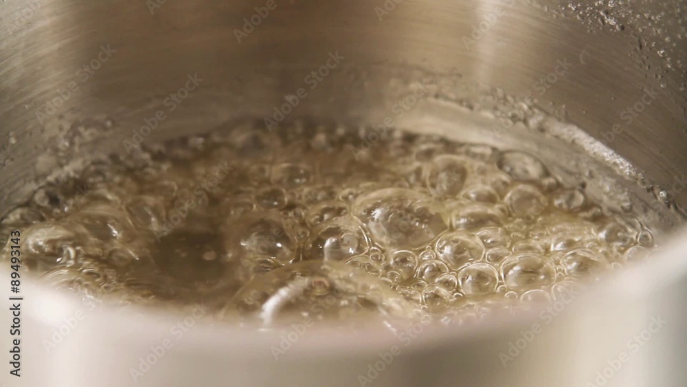 Sugar syrup being heated in a pot Sugar syrup being heated in a pot