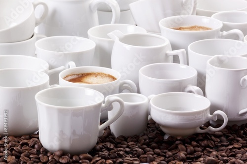 An arrangement of coffee with hot coffee and white crockery