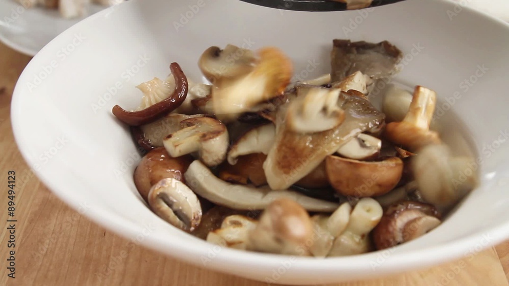 Fried mushroom being removed from the pan Fried mushroom being removed from the pan