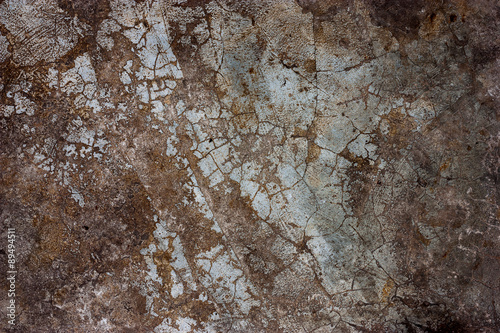 Textured walls with dirt.