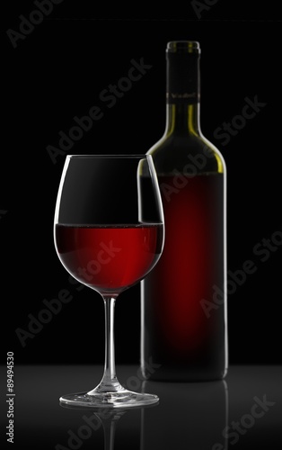 Red wine in a glass and a bottle