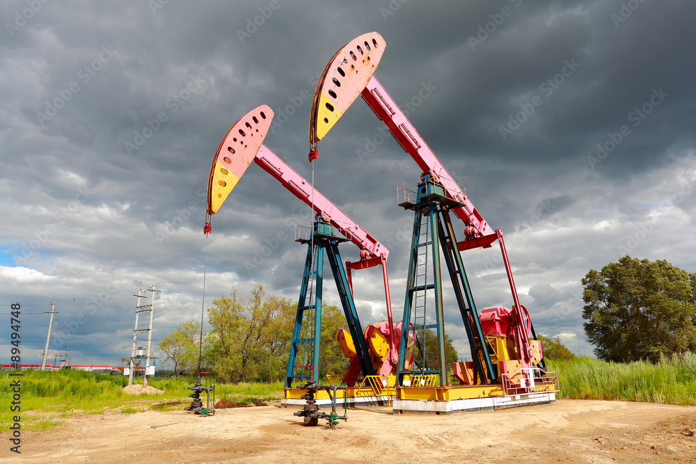 Pink Oil pump oil rig energy industrial machine on the side of d Pink Oil pump oil rig energy industrial machine on the side of d