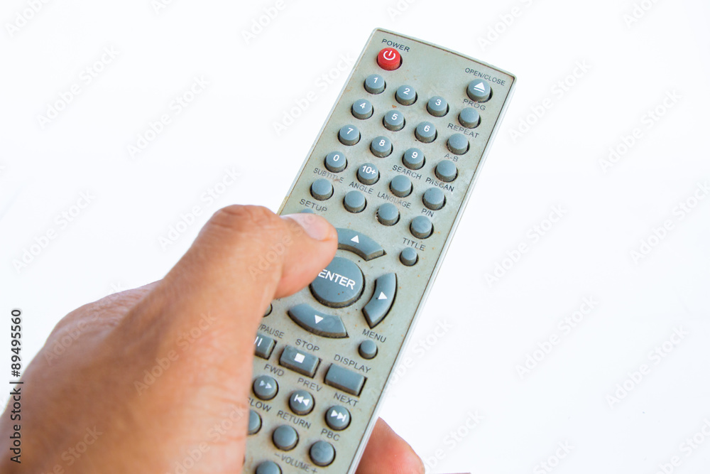 hand use remote control on white background hand use remote control on white background