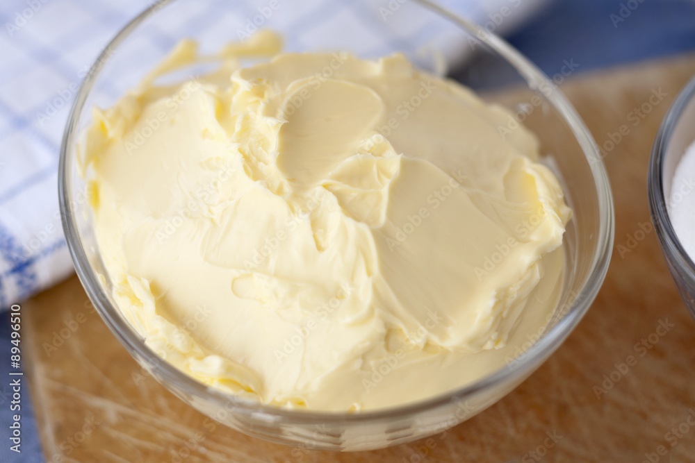 Butter in a small glass dish as a baking ingredient Butter in a small glass dish as a baking ingredient