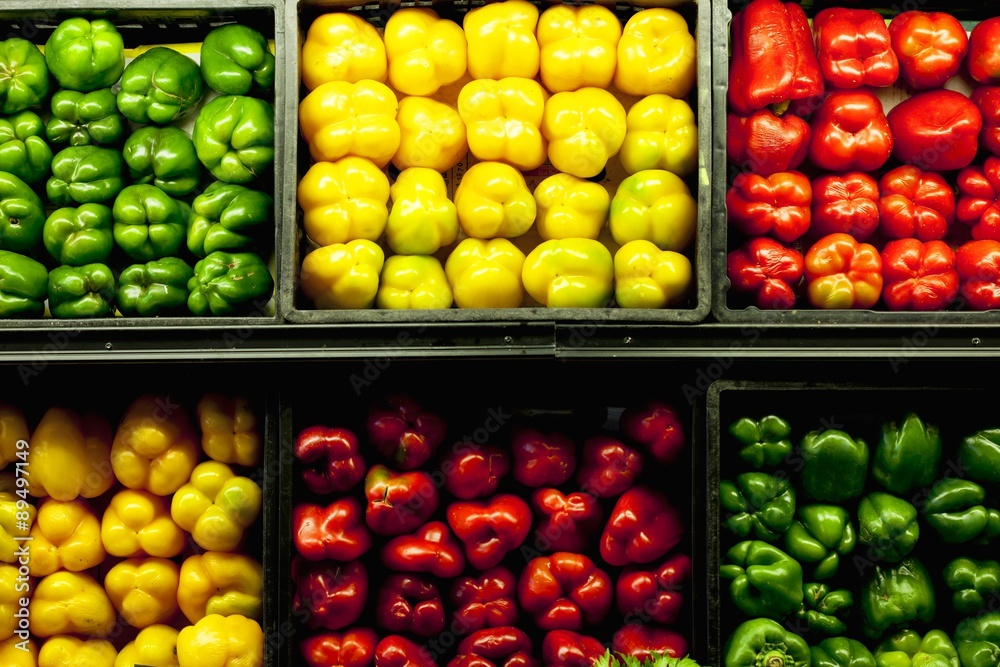 Green, yellow and red peppers for sale at farmers market Green, yellow and red peppers for sale at farmers market