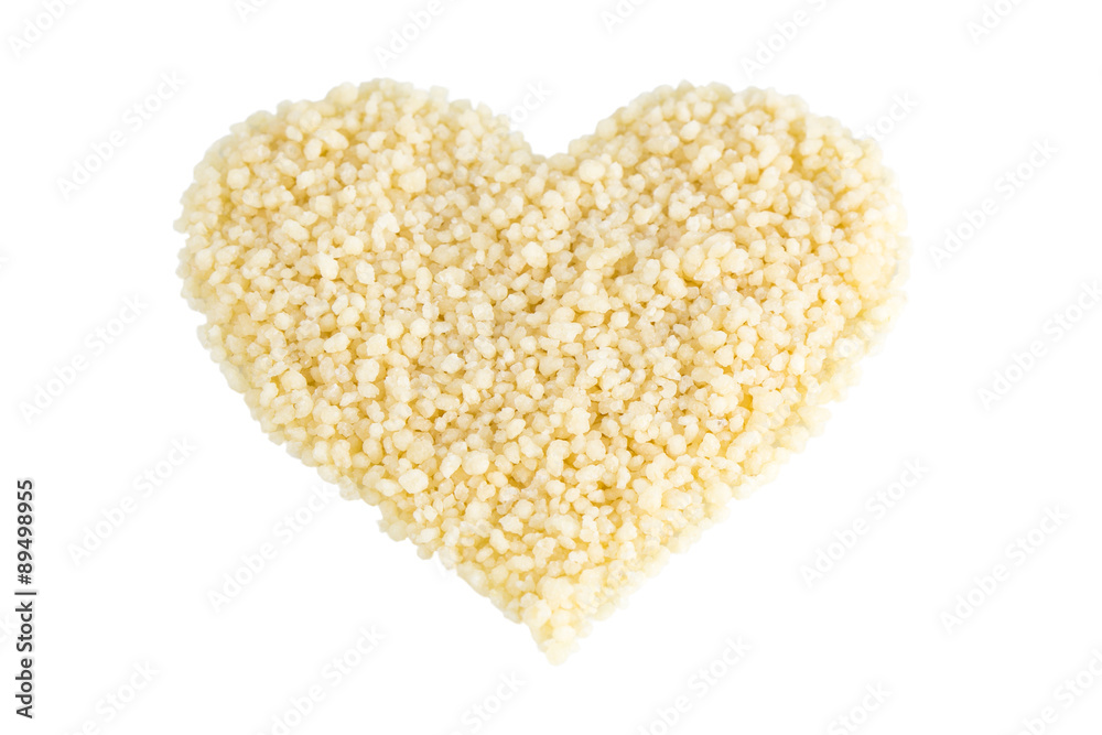 Heart shape made of couscous, tilted angle, isolated on white background. Heart shape made of couscous, tilted angle, isolated on white background.