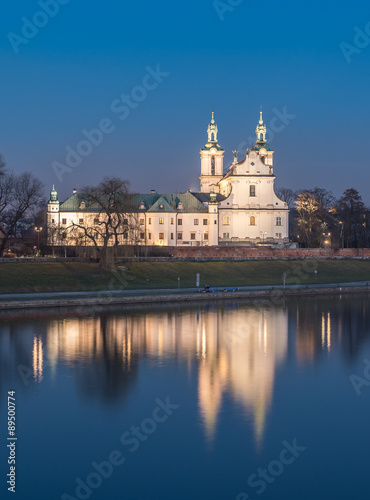 Krakow, Poland, scenic Vistula riverbank with Pauline fathers church (Skalka) in the evening #89500774