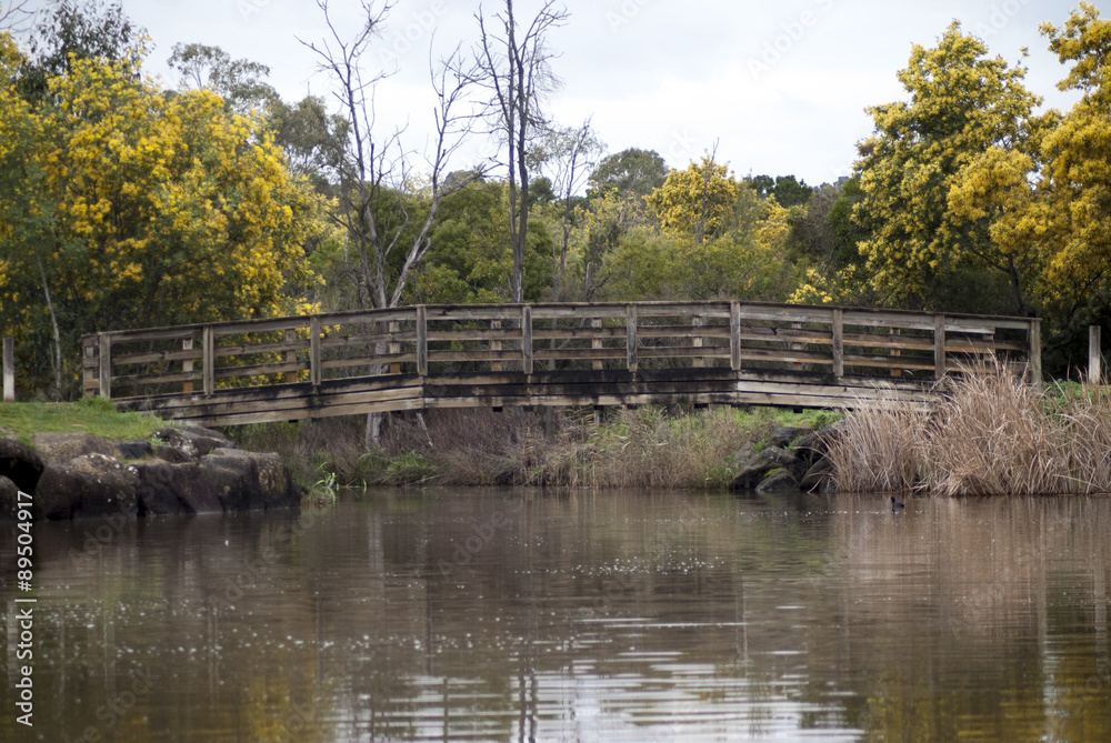 Fototapeta premium a wooden timber bridge over water