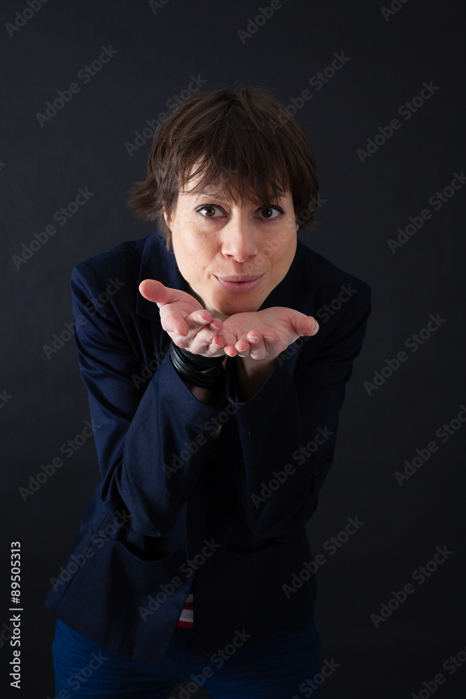Beautiful woman doing different expressions in different sets of clothes: kiss Beautiful woman doing different expressions in different sets of clothes: kiss
