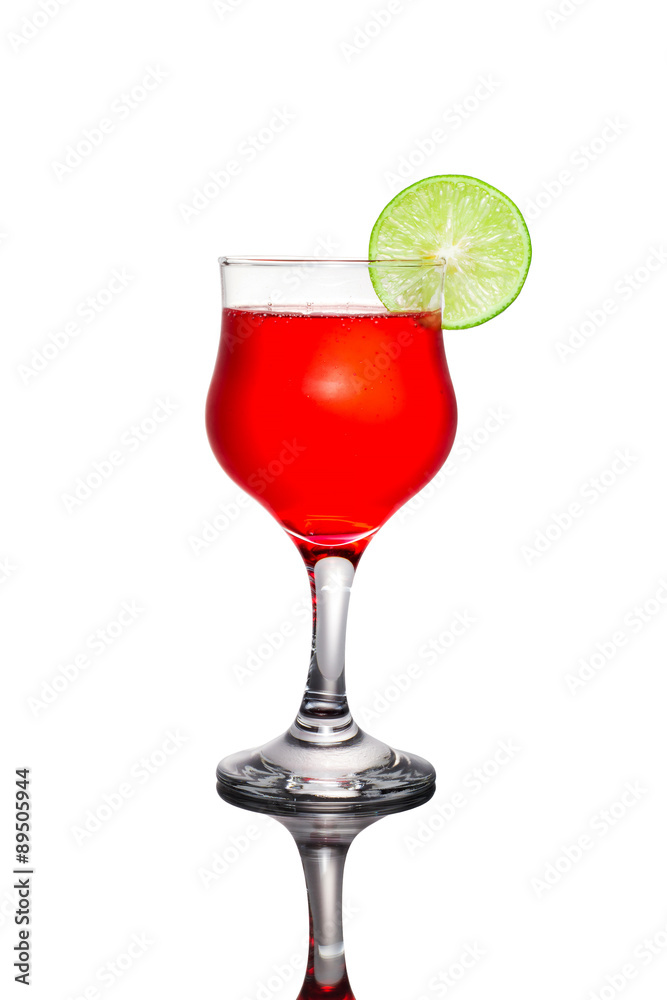 Red cocktail and lime on white background.