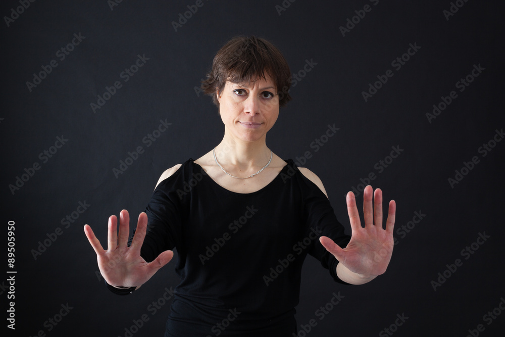 Beautiful woman doing different expressions in different sets of clothes: stop sign Beautiful woman doing different expressions in different sets of clothes: stop sign
