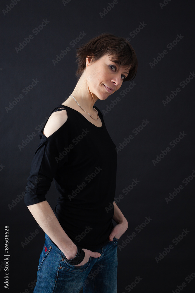 Beautiful woman doing different expressions in different sets of clothes: hands in pockets Beautiful woman doing different expressions in different sets of clothes: hands in pockets
