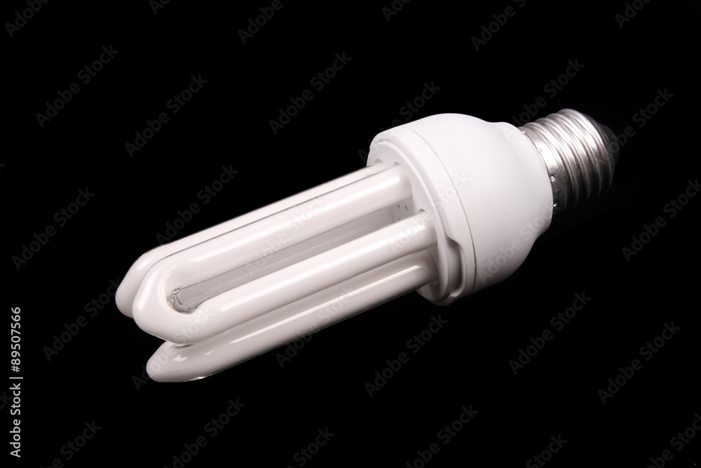 Energy efficient light bulb on black background Energy efficient light bulb on black background