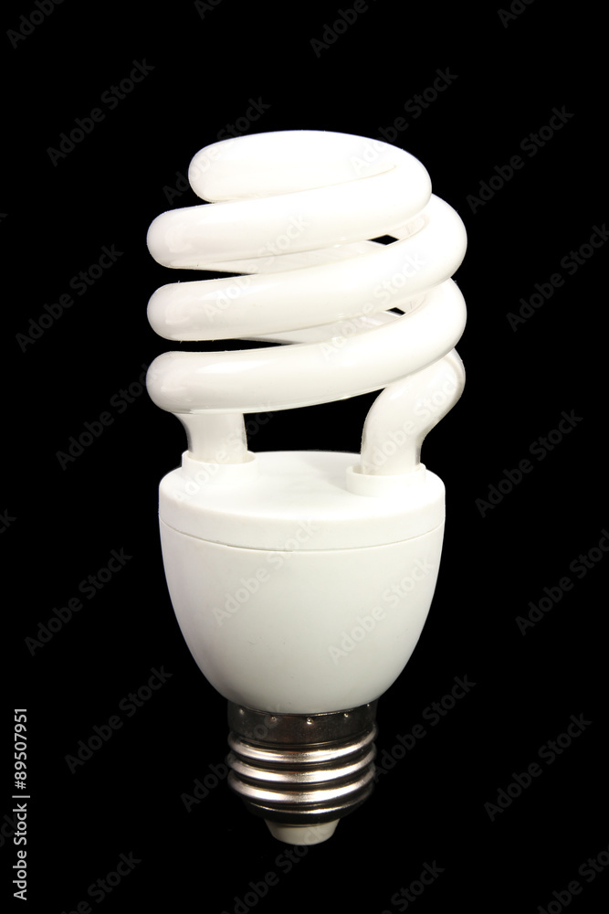 Spiraled Energy efficient light bulb on black background Spiraled Energy efficient light bulb on black background