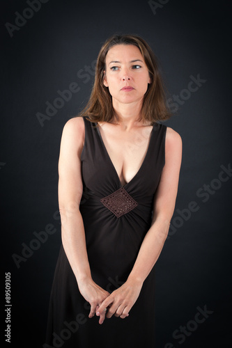 Beautiful woman doing different expressions in different sets of clothes: thinking