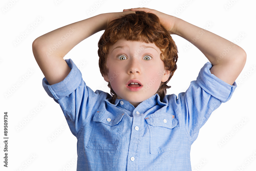 Handsome boy with surprised facial expression. Isolated on white