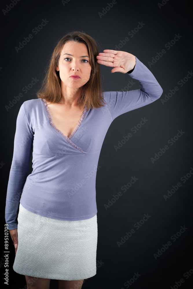 Beautiful woman doing different expressions in different sets of clothes: at attention Beautiful woman doing different expressions in different sets of clothes: at attention