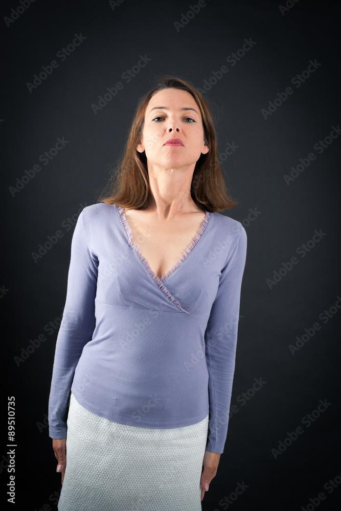 Beautiful woman doing different expressions in different sets of clothes: at attention Beautiful woman doing different expressions in different sets of clothes: at attention