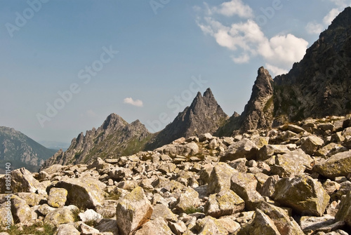 stones and panorama of really sharp peaks during hiking to Rysy peak in Tatry mountains