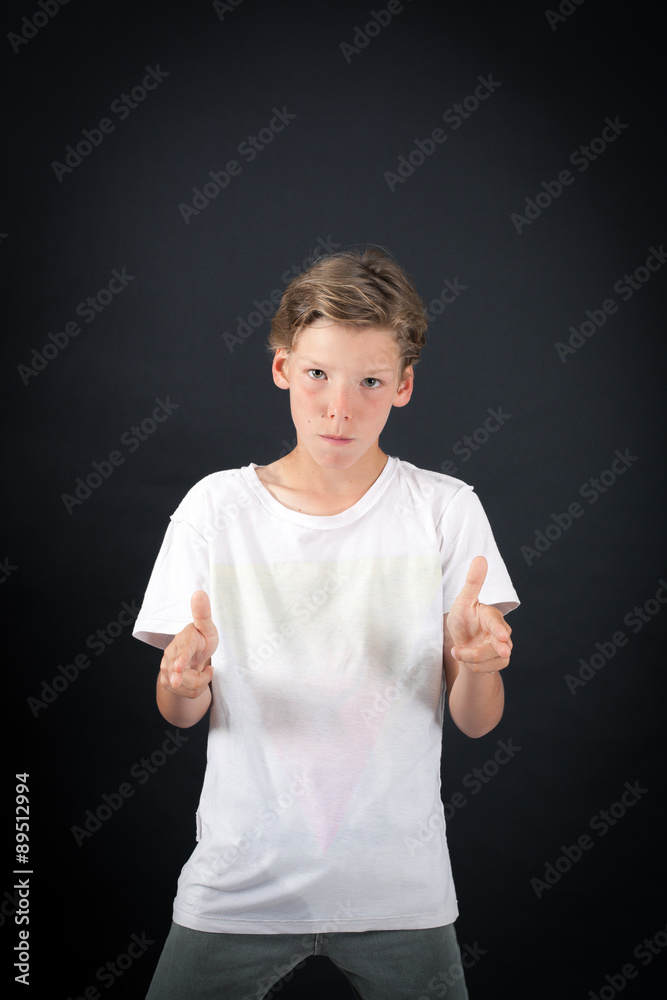 Handsome boy doing different expressions in different sets of clothes: gun sign Handsome boy doing different expressions in different sets of clothes: gun sign
