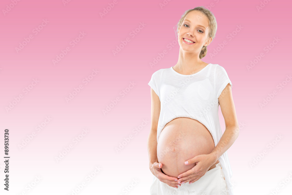 Beautiful pregnant woman on pink gradient background Beautiful pregnant woman on pink gradient background