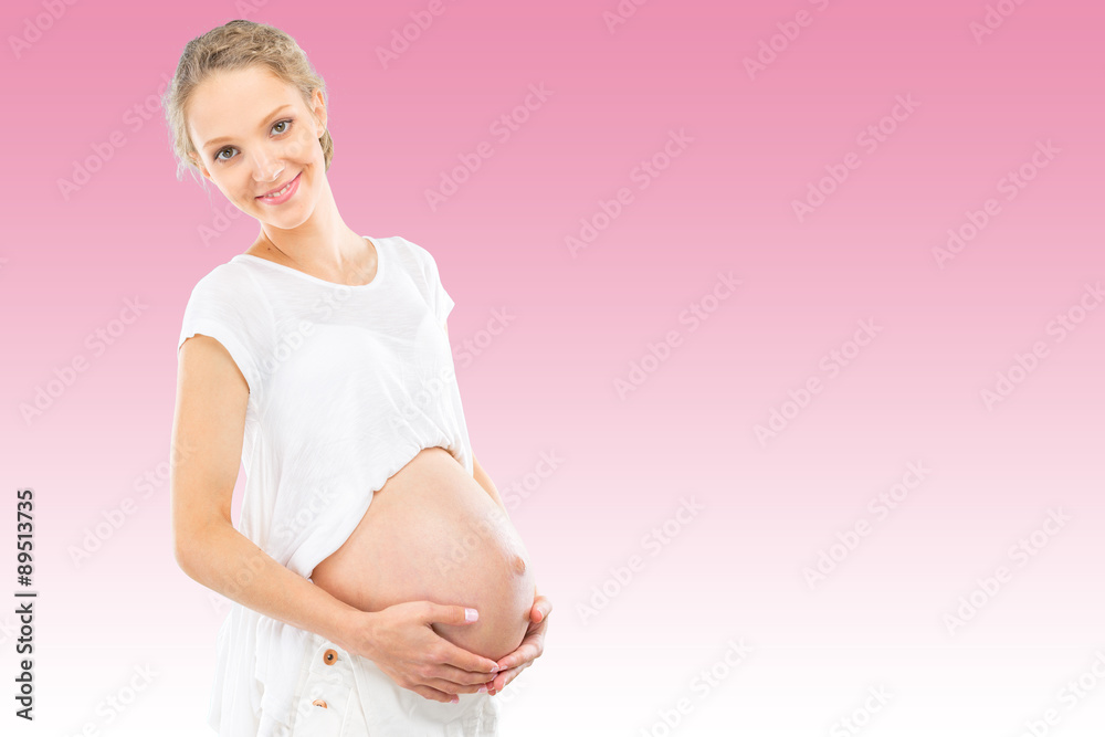 Beautiful pregnant woman on pink gradient background Beautiful pregnant woman on pink gradient background
