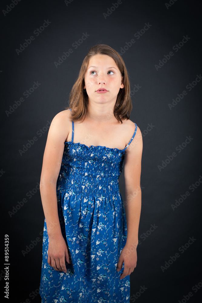 Beautiful girl doing different expressions in different sets of clothes: thinking