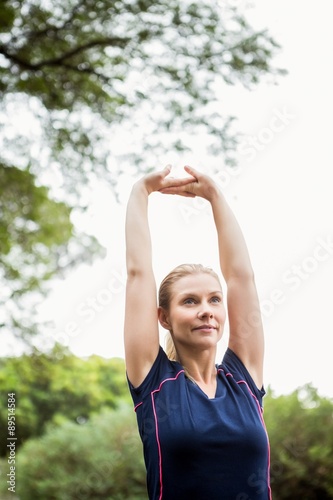Athletic woman doing arms stretching