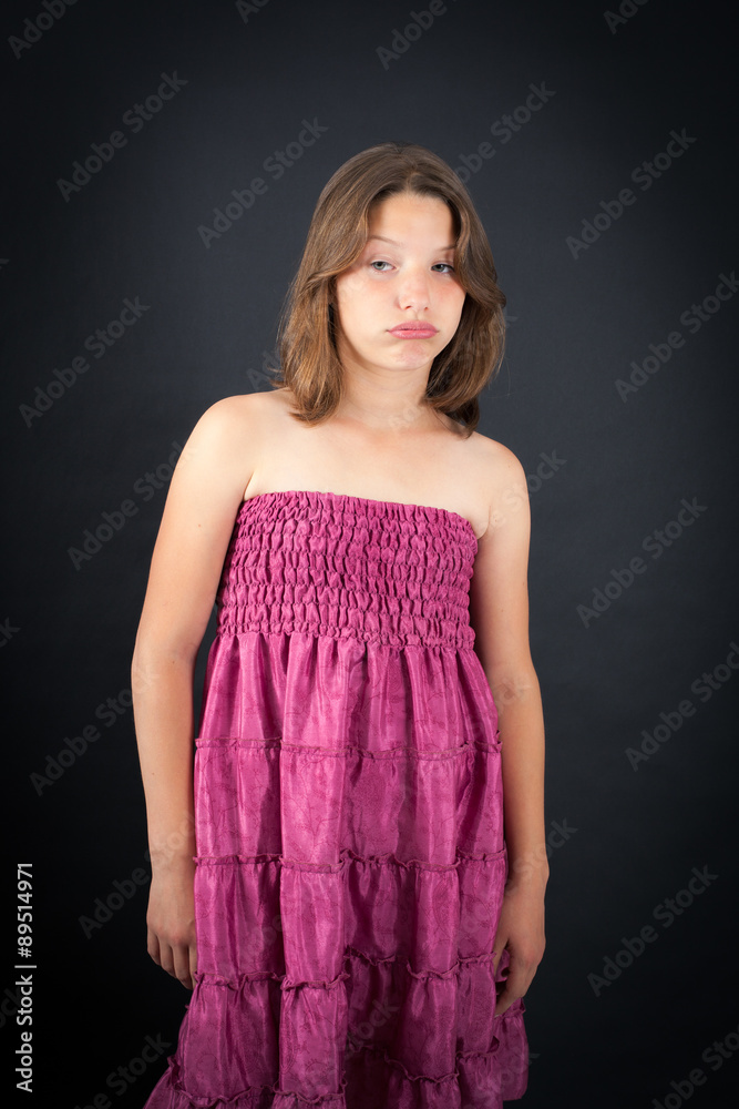 Obraz premium Beautiful girl doing different expressions in different sets of clothes: bored