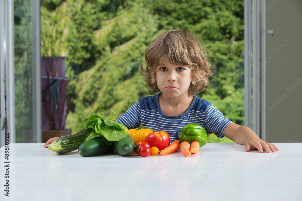Fototapeta premium Little boy vegetable meal