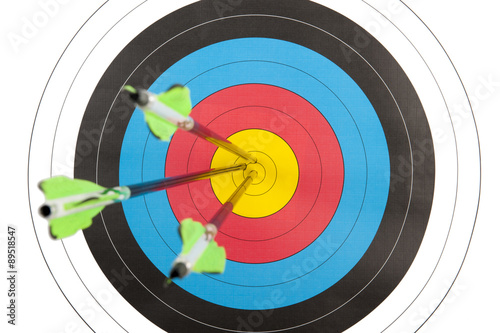 Archery target hit by three arrows