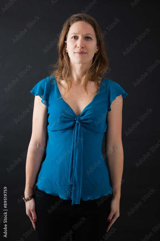 Beautiful woman doing different expressions in different sets of clothes: at attention Beautiful woman doing different expressions in different sets of clothes: at attention