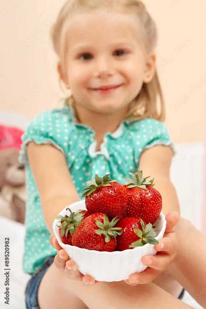 Happy little girl with strawberries Happy little girl with strawberries