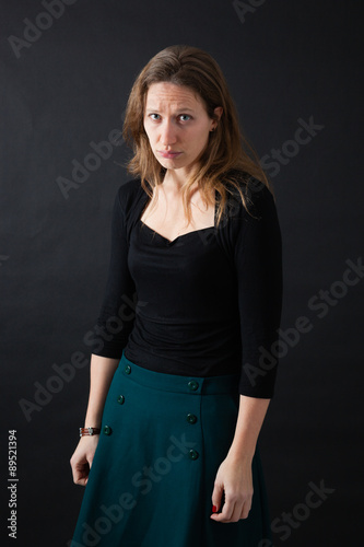 Beautiful woman doing different expressions in different sets of clothes: sad