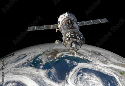 Fototapeta Naklejka Na Ścianę i Meble -  Spacecraft Soyuz over the planet earth